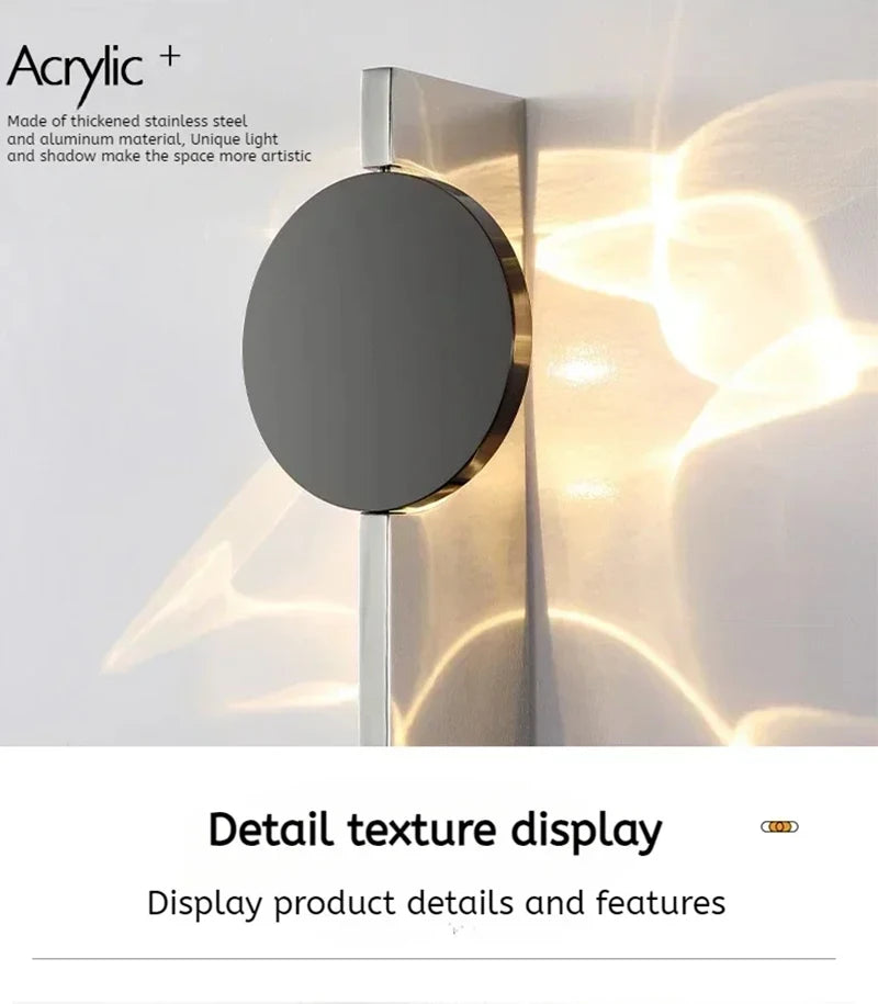 Modern wall light fixture with metallic finish on a textured wall background